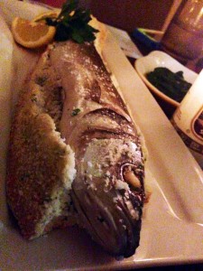 Salt crusted whole bronzino fish