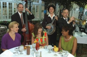 Court of Two Sisters diners are entertained by strolling jazz musicians